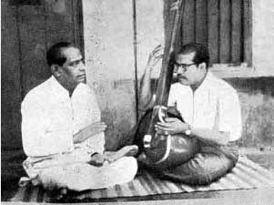 Mana Dey taking lassons from his uncle, Krishna Chandra Dey 