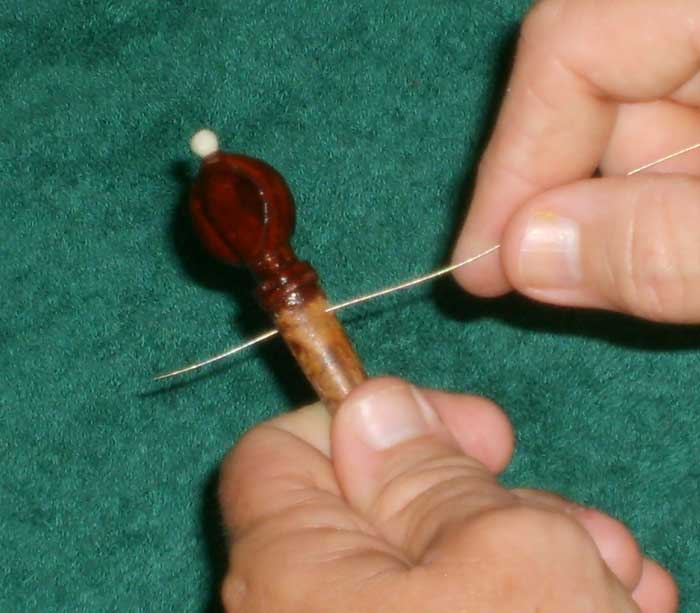 Mounting a dilruba string (friction peg step 1)
