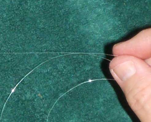 Mounting a esraj string (step 1)